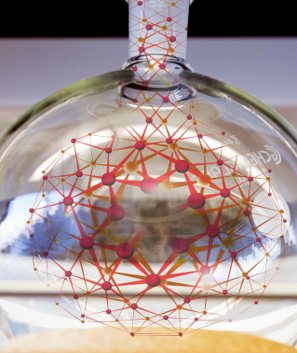 A red mesh inside a glass bottle