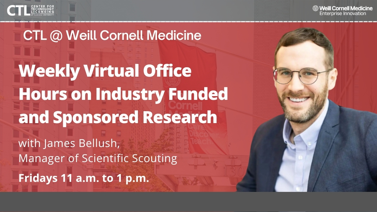 Caucasian man wearing glasses and a gray suit