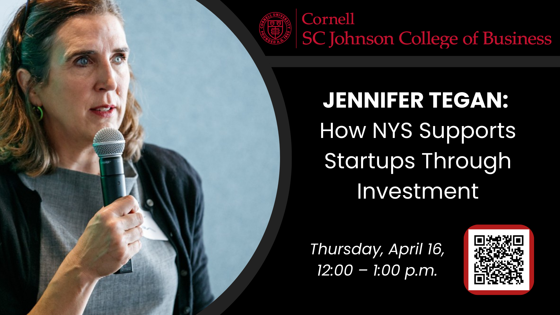 Middle-aged Caucasian woman with light brown hair holding a mic and wearing a gray dress