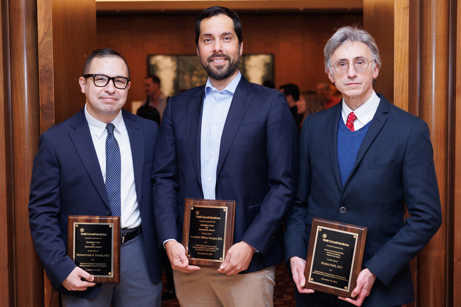 2024 Awardees. From left: Dr. Mohammed Fouda, Dr. Jonathan Villena-Vargas and Dr. Shahin Rafii. Photo credit: Ashley Jones. Three men wearing dark blue suits and holding award plaques