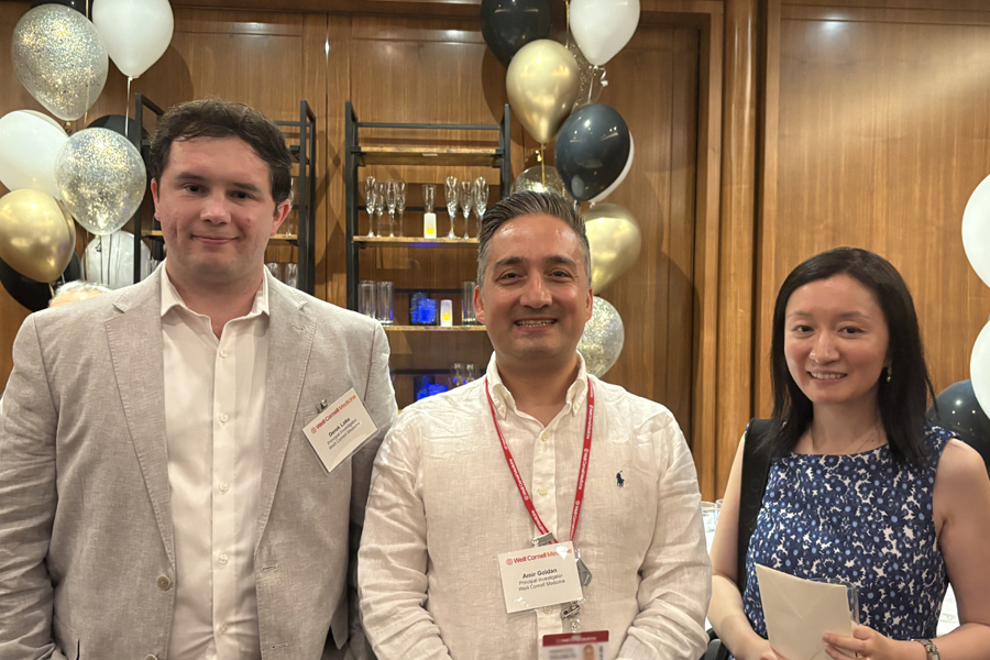 Presenters of Competing Teams. From Left to Right: Dr. Derek Lake, Dr. Amir Goldan and Dr. Yiye Zhang. A group of two men (left and center) and a woman in business casual attire