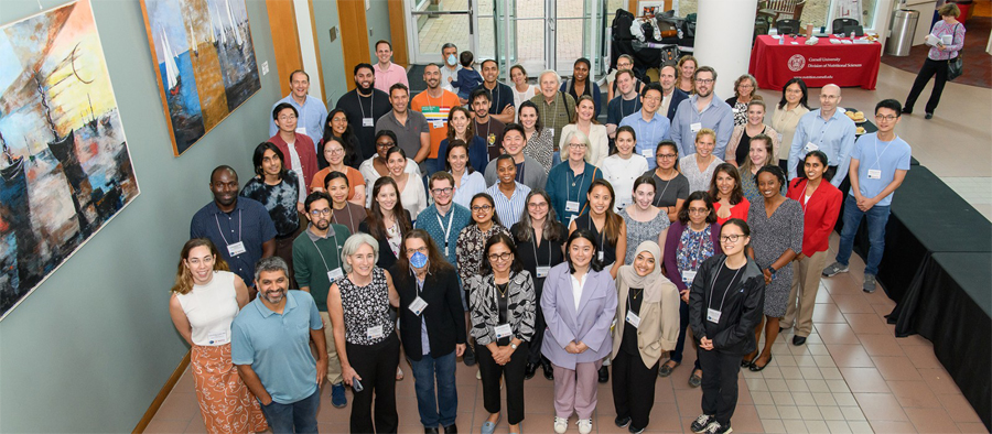 A group of scientists is having their photo taken at a conference