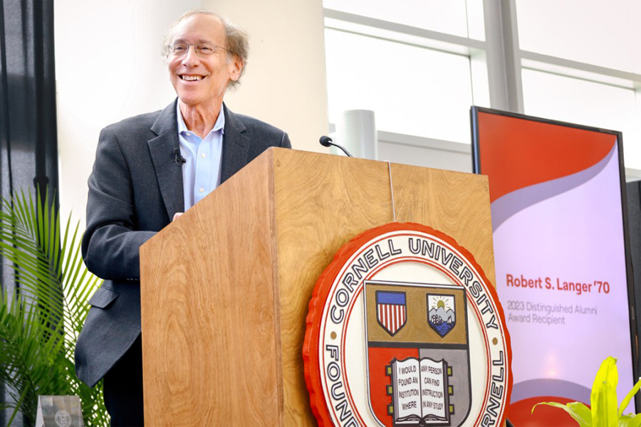 Robert Langer '70 (Provided) Robert Langer speaking at a podium with the Cornell University logo.