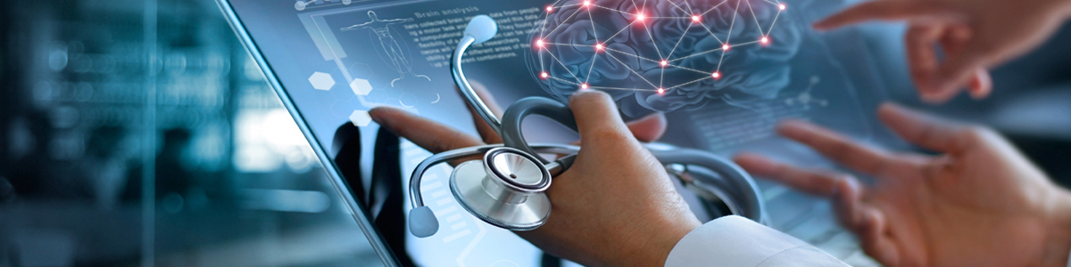 Two doctors' hands pointing to a computer screen with brain image. One hand is holding a stethoscope.
