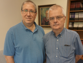 two men posing together
