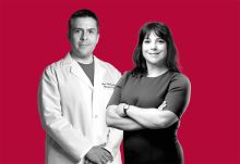 Black-and-white portrait of Drs. Lisa Placanica and Juan Cubillos-Ruiz against a Cornell red background. Dr. Cubillos-Ruiz is in his white coat, while Dr. Placanica is wearing a dress.