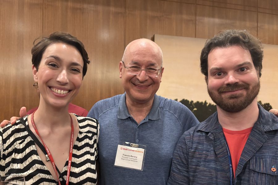 A young Caucasian woman and two Caucasian men (one older and one young).