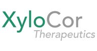 Company logo with the letters "Xylo" in green and the "Cor" and the word "Therapeutics" in light gray.
