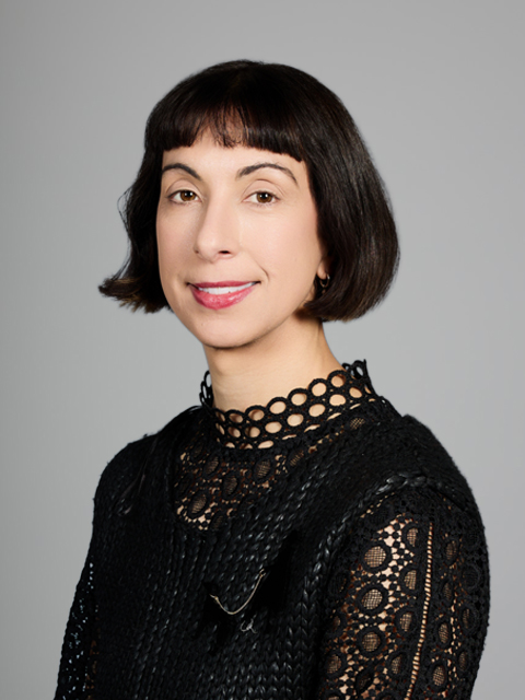 Caucasian woman with dark bob cut